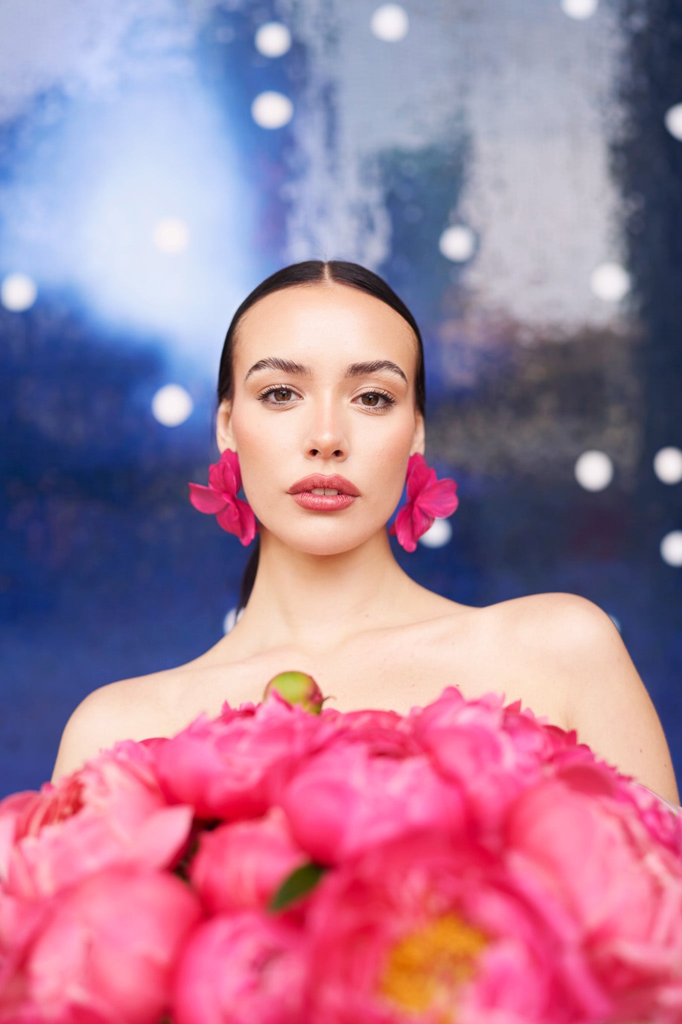 A beautiful woman with pink peonies