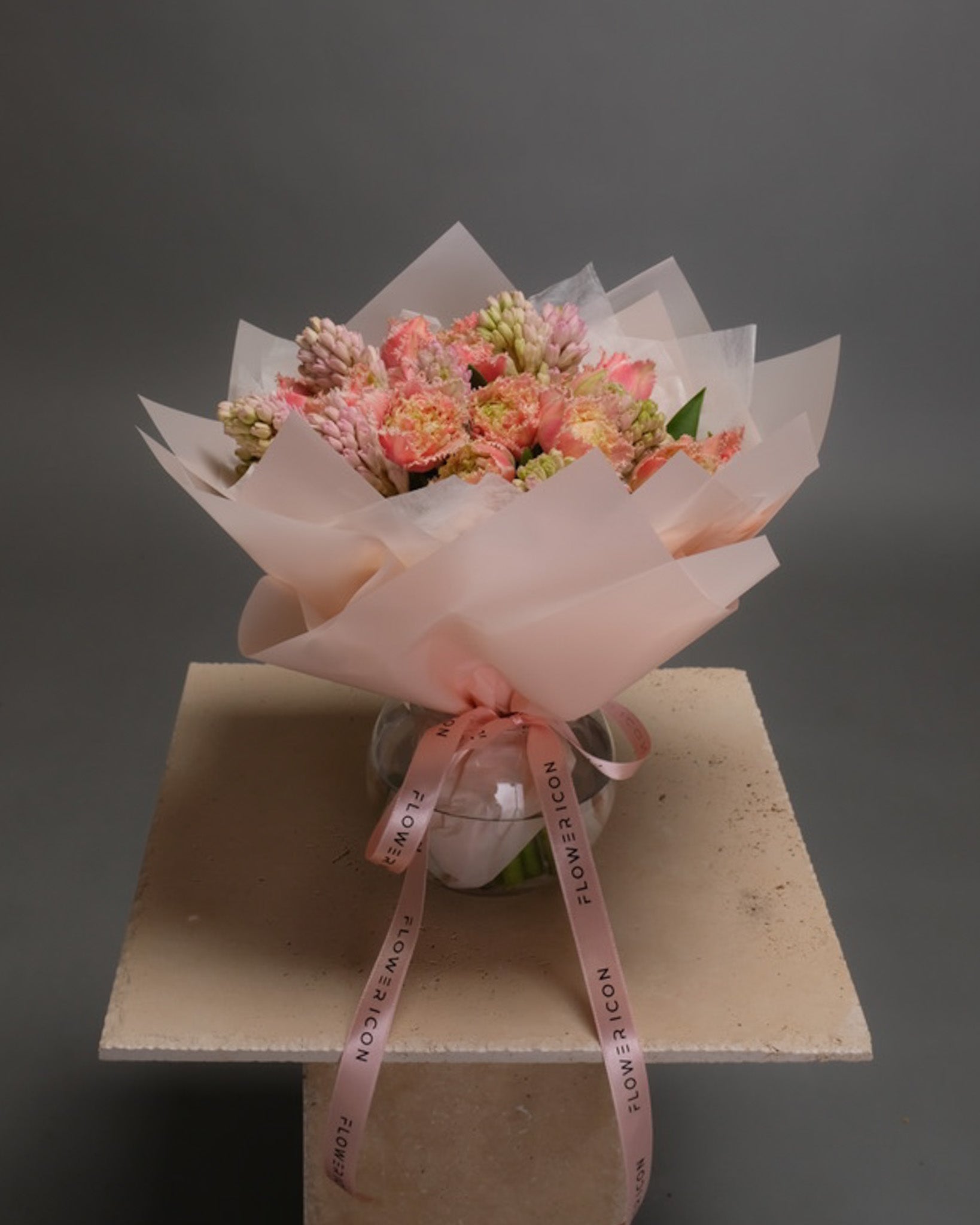 Elegant spring flower arrangement with tulips and hyacinths in a vase – vibrant yet delicate seasonal mix