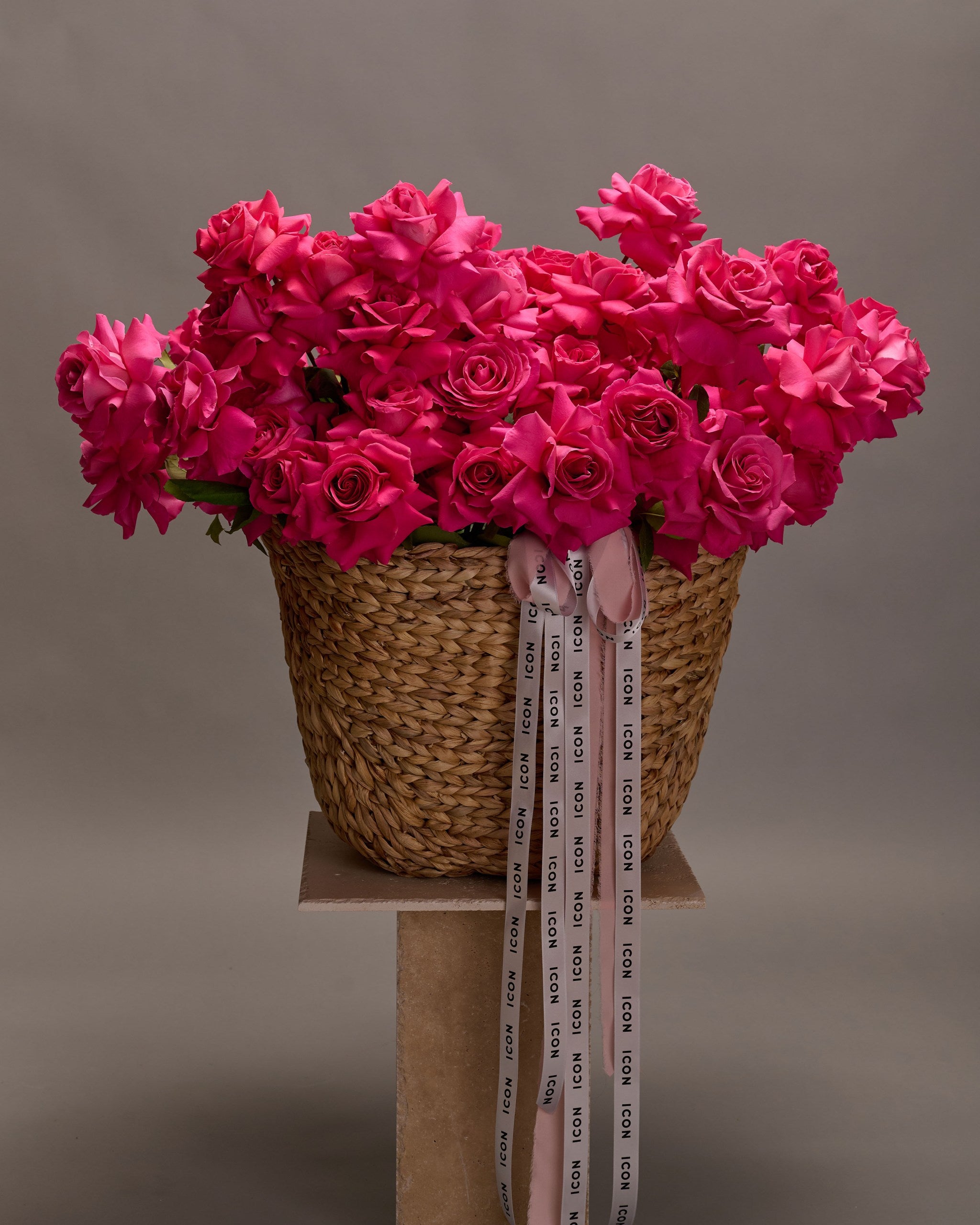 Large basket of vibrant hot pink roses – bold and luxurious floral gift for celebrations or romantic occasions