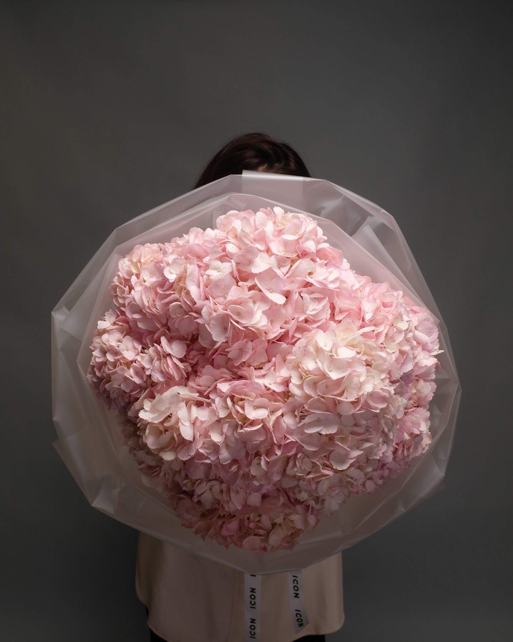 Hand-held mono bouquet of large pink hydrangeas – soft, voluminous, and romantic floral statement