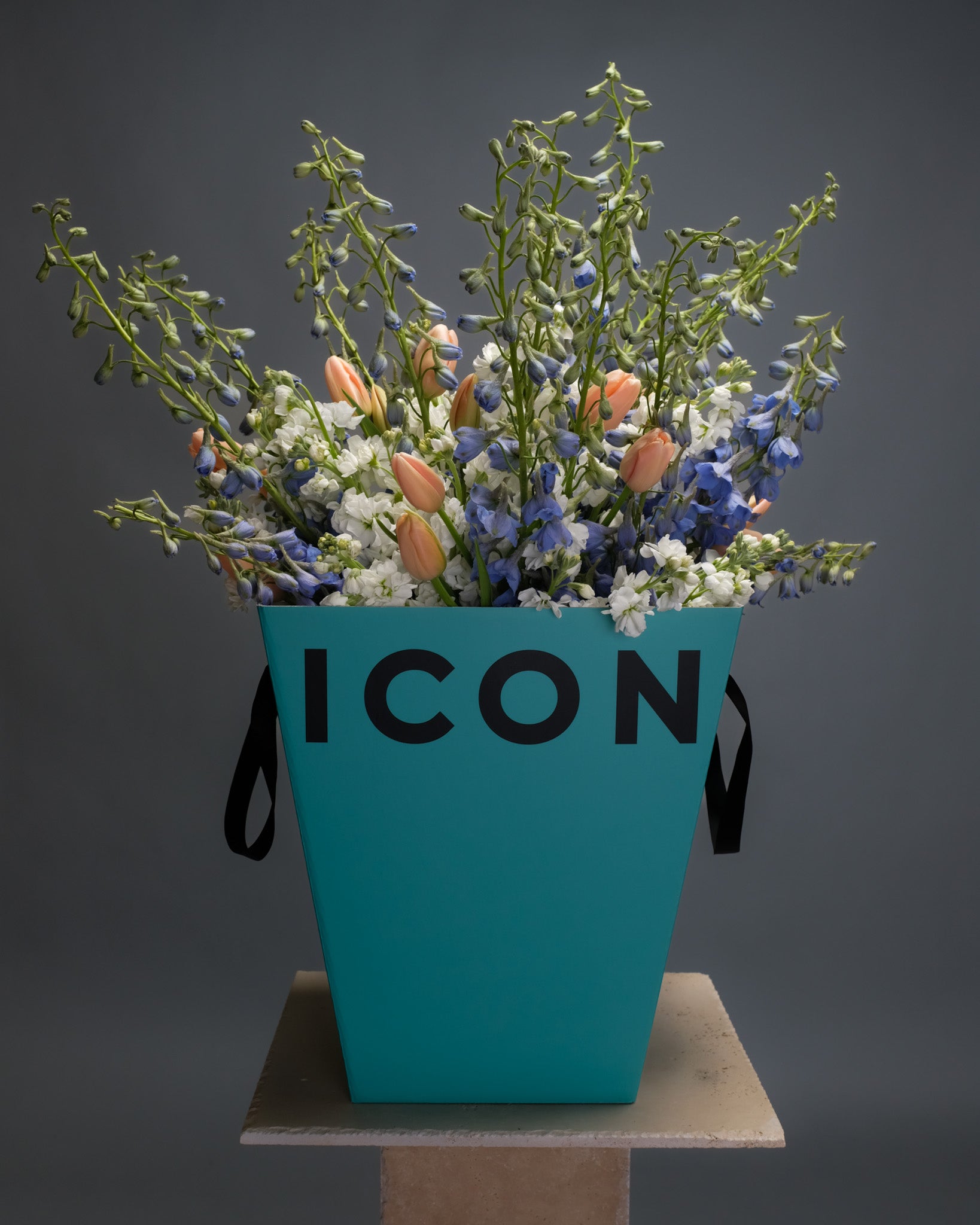 Luxurious mixed flower bouquet in Flower Icon’s  blue gift box – featuring vibrant seasonal blooms in blue, coral, and white