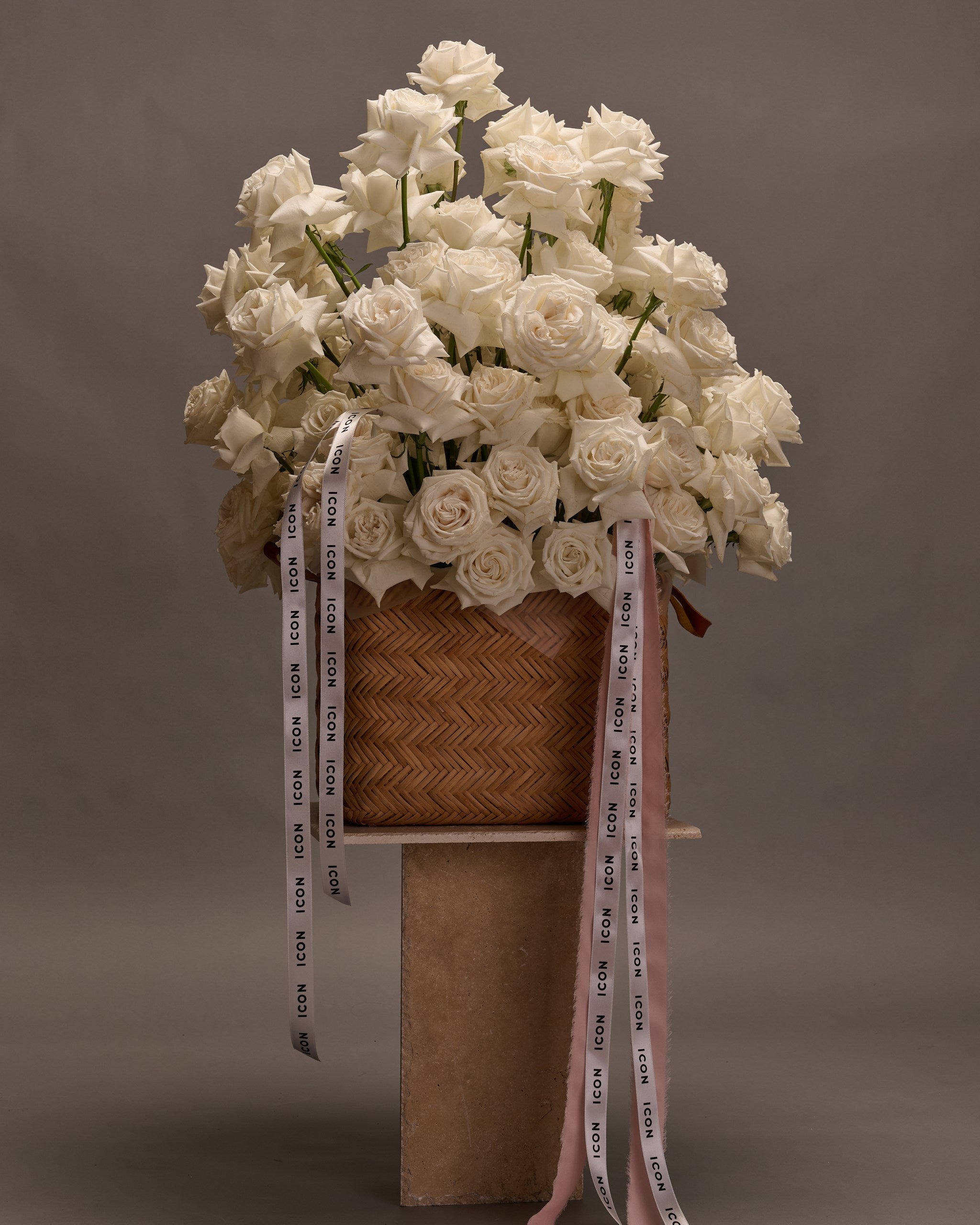 Extra large white rose arrangement in a modern basket – elegant floral design for weddings, celebrations, or grand gestures