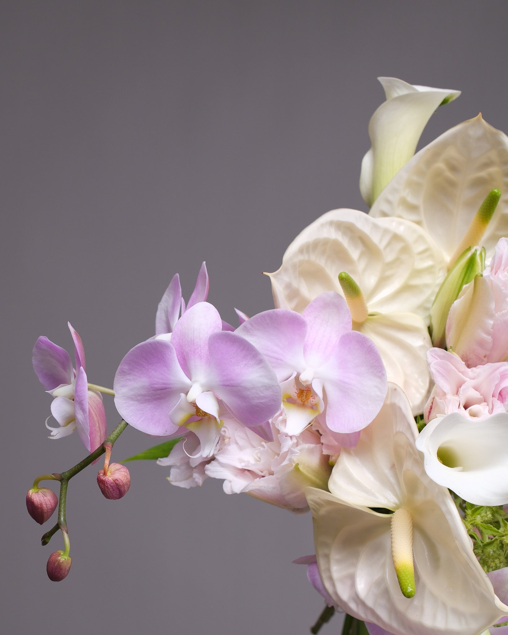 Pastel exotic bridal bouquet with double lilies, orchids and trailing amaranthus — luxury wedding flowers San Francisco Bay Area