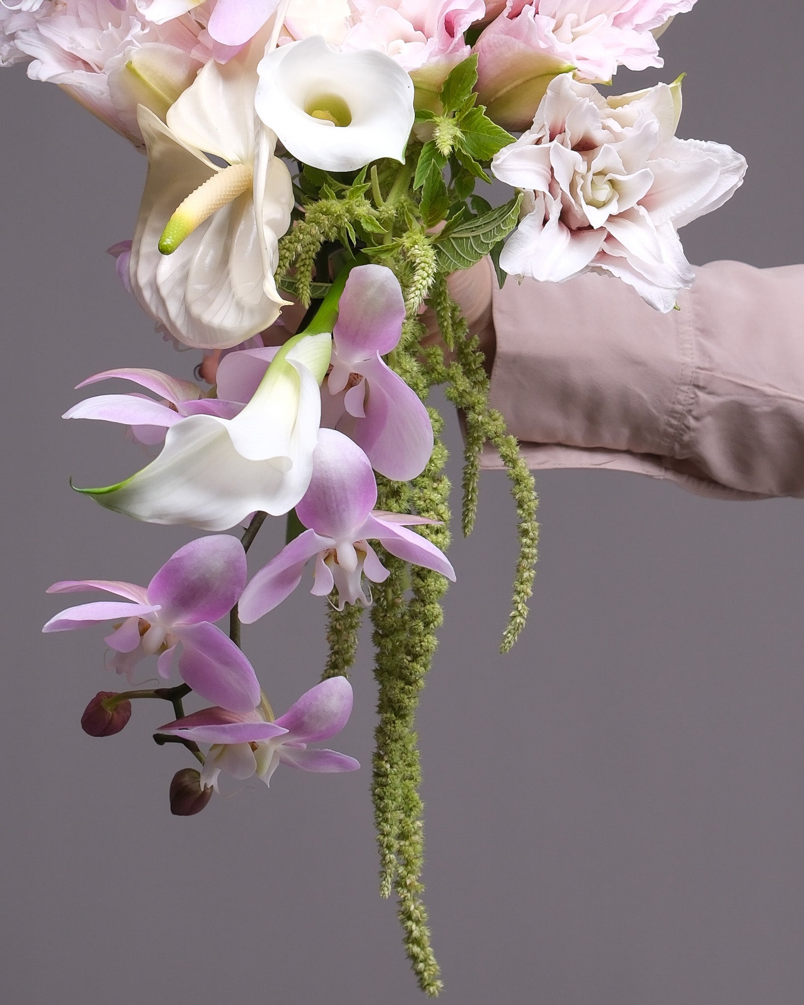 Romantic exotic bridal bouquet held by bride — Pink Orchid Cascade by Flower Icon San Francisco
