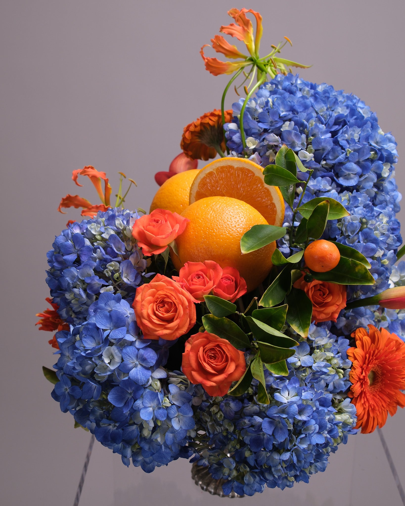 Aperitivo — Signature Blue Hydrangea & Orange Arrangement
