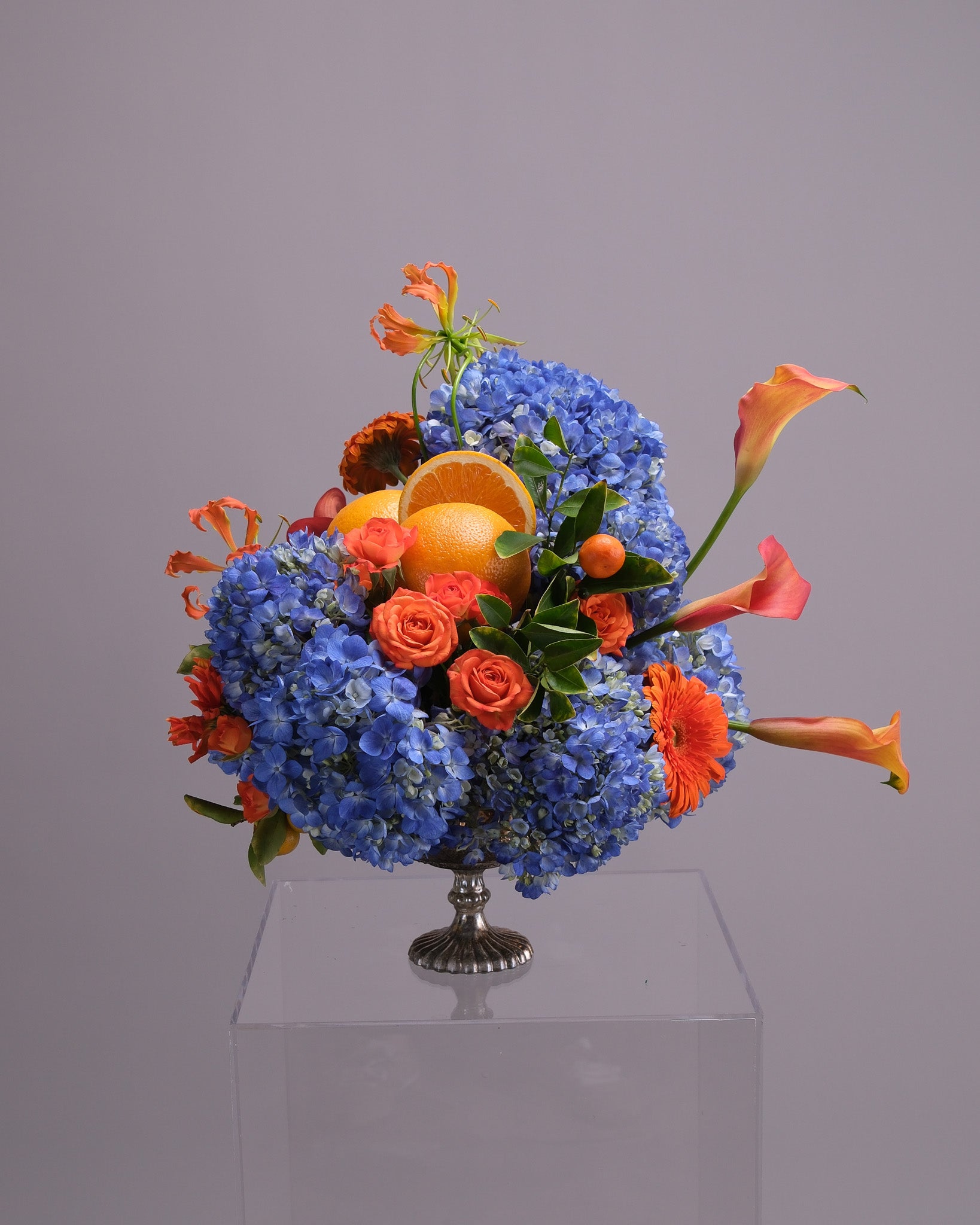 Aperitivo — Signature Blue Hydrangea & Orange Arrangement