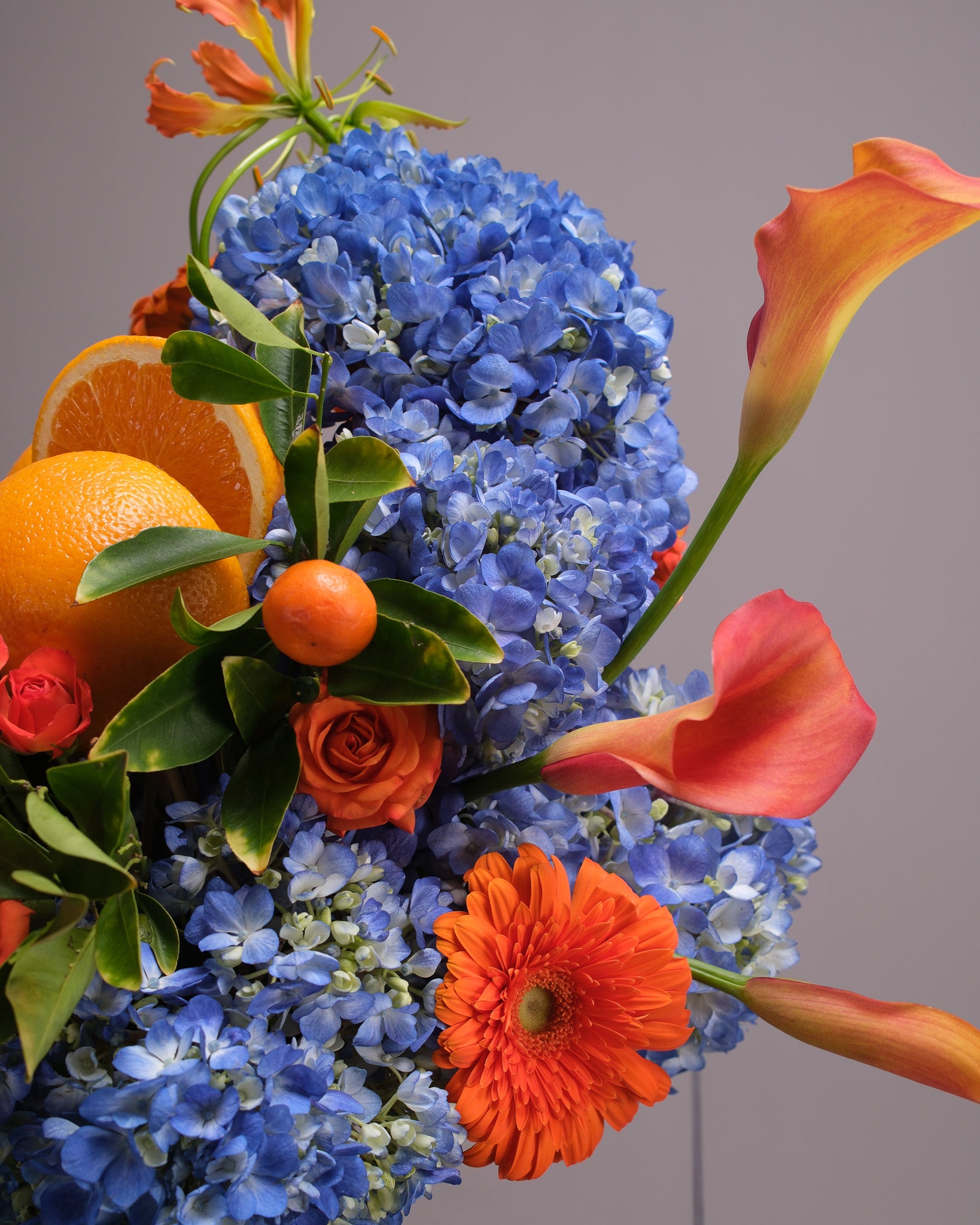Aperitivo — Signature Blue Hydrangea & Orange Arrangement
