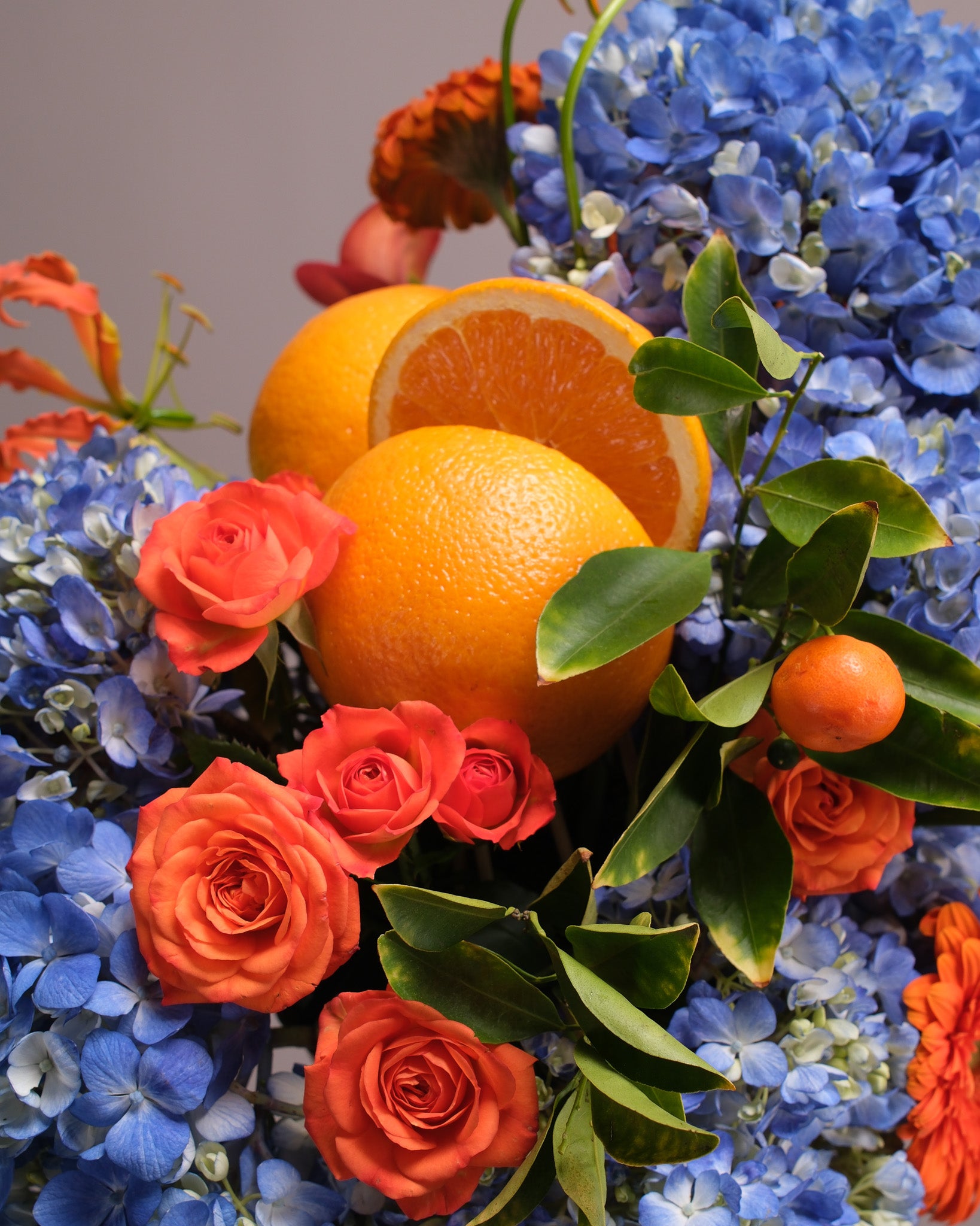 Aperitivo — Signature Blue Hydrangea & Orange Arrangement
