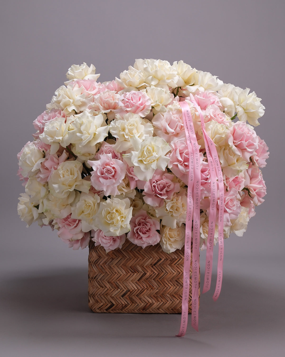 Huge basket of pink and white French roses with Flower Icon ribbon — luxury rose delivery San Francisco