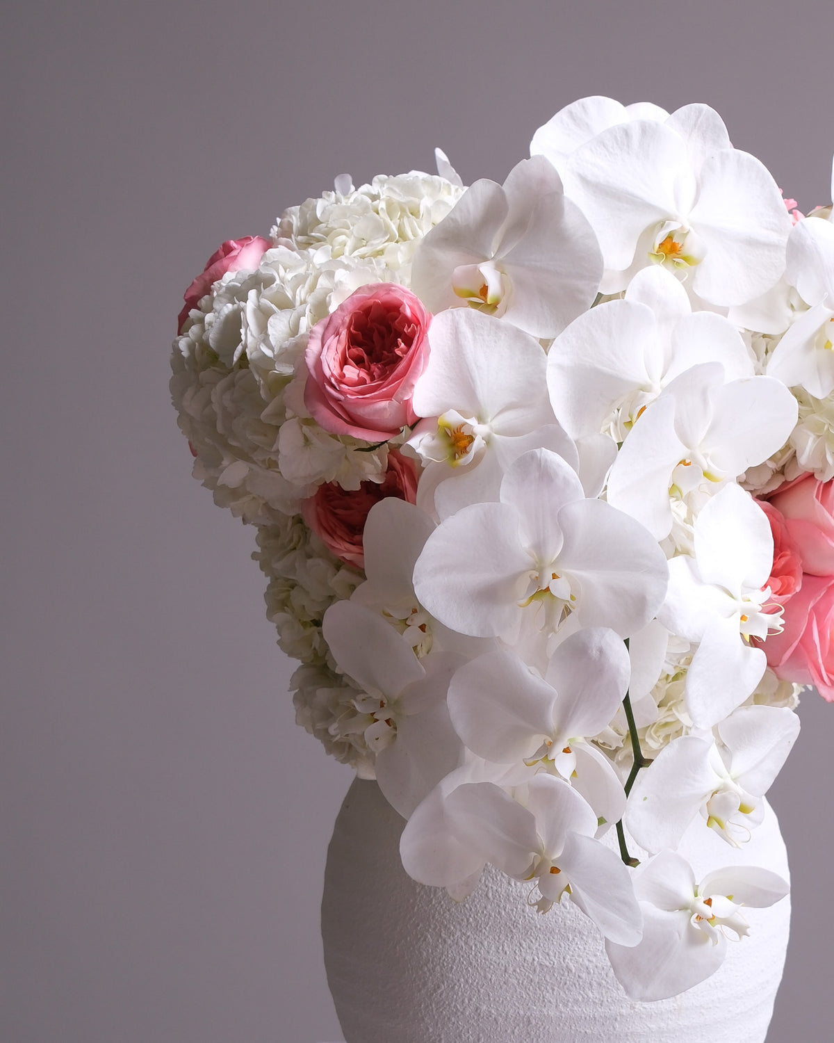 Pink Garden Rose & Orchid Arrangement in White Vase