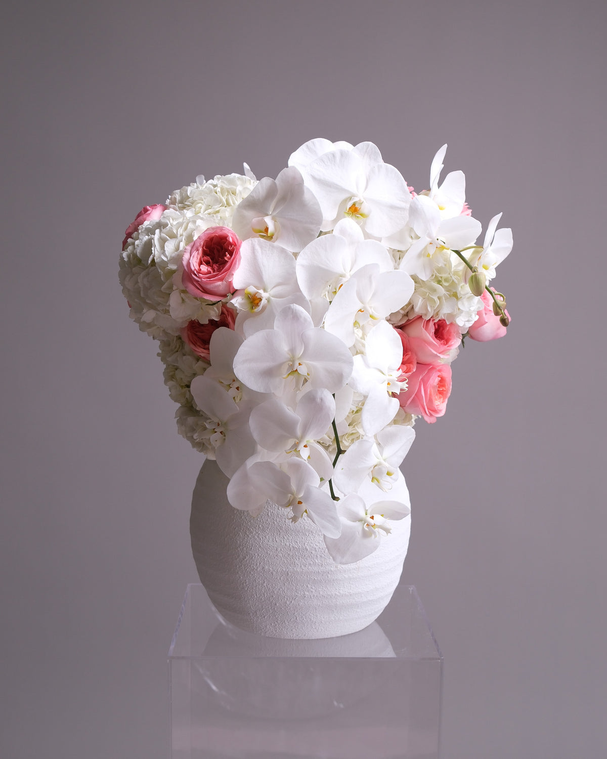 Pink Garden Rose & Orchid Arrangement in White Vase
